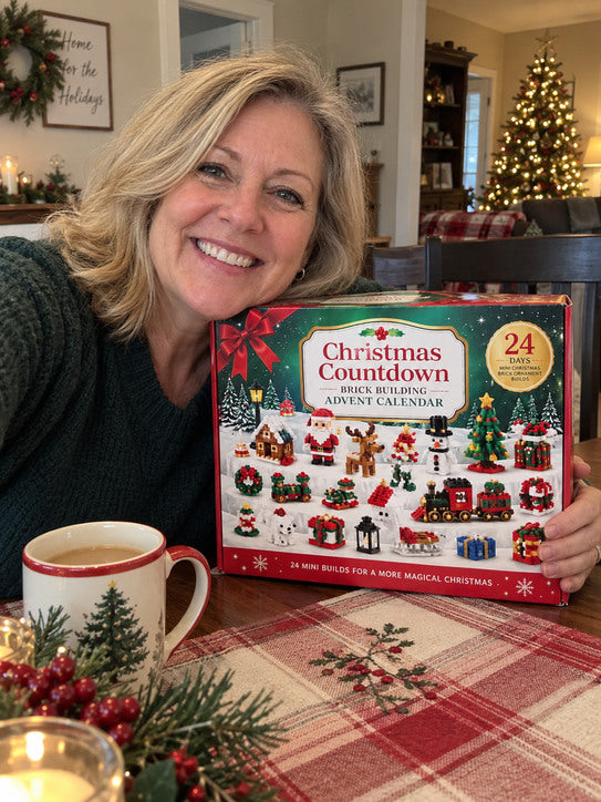 Blonde woman smiling with Christmas countdown calendar at a cozy table.